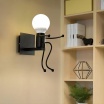 Applique da parete omino seduta bianco nero attacco E27 lampada particolare moderno per camera cameretta bambini